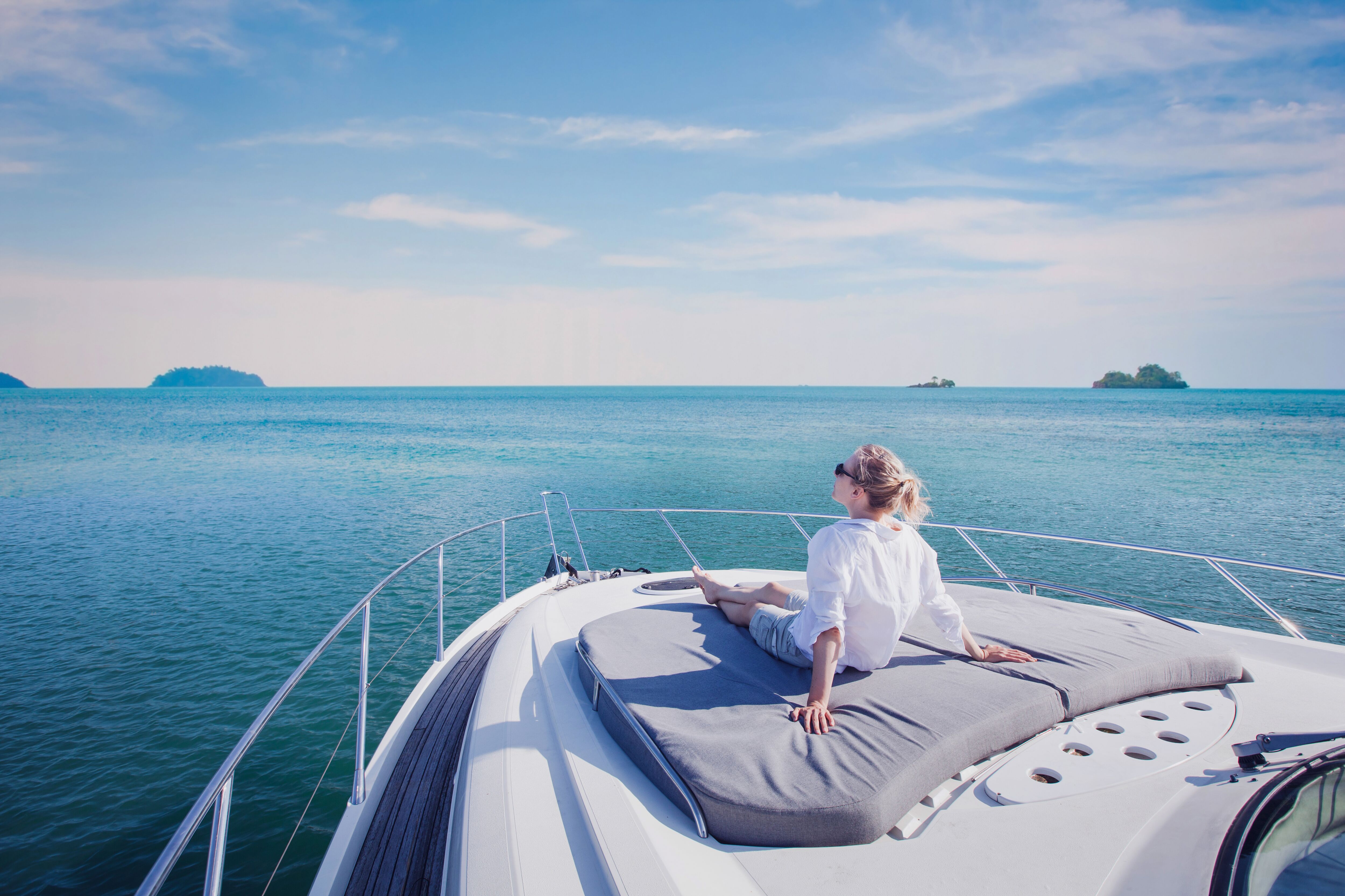Woman enjoying luxurious yacht cruise.